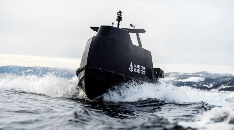 Close-up of the Mariner X vessel slicing through water, emphasizing its stability and hydrodynamic shape.