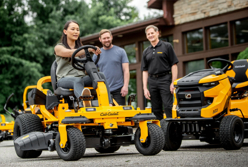 woman driving zero turn mower